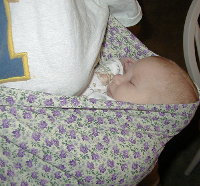 Katie snoozing in her sling